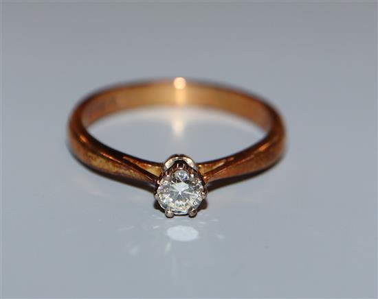 A modern 18ct gold and diamond solitaire ring, size N.